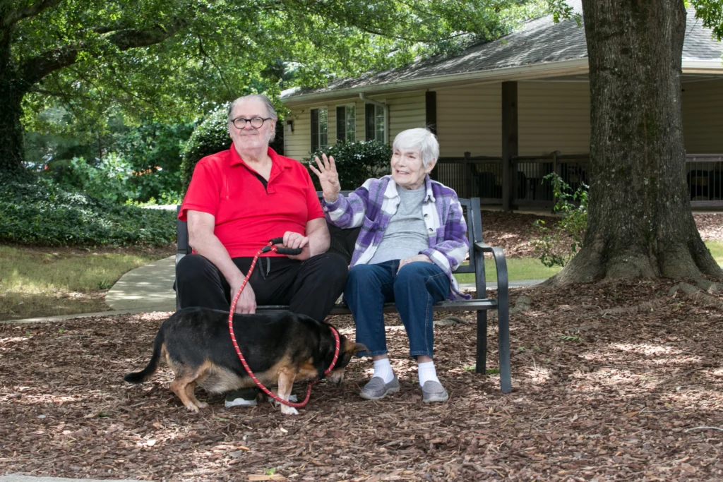 couple playing with their dog